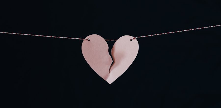 Torn paper heart - Photo by Kelly Sikkema on Unsplash